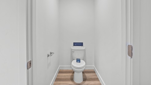 A toilet room in the primary bathroom.