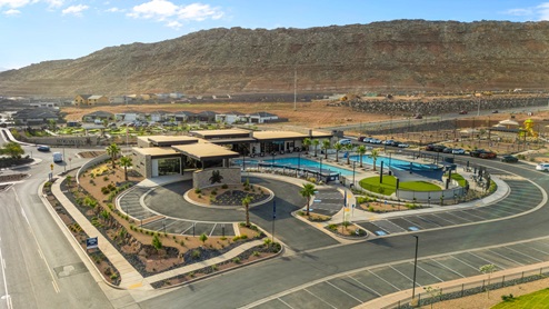 Lower Aerial view of the Long Valley community entrance sign in front of the expansive and stylish clubhouse.