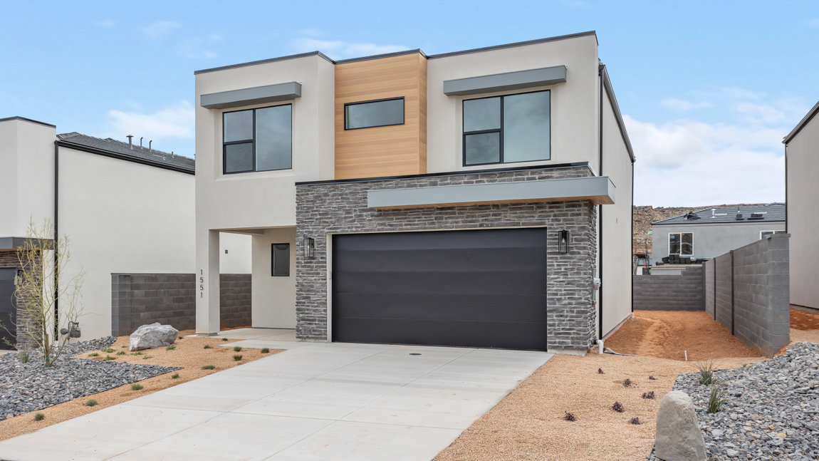 Brand new single family home in Washington with a Modern style exterior and two car garage.