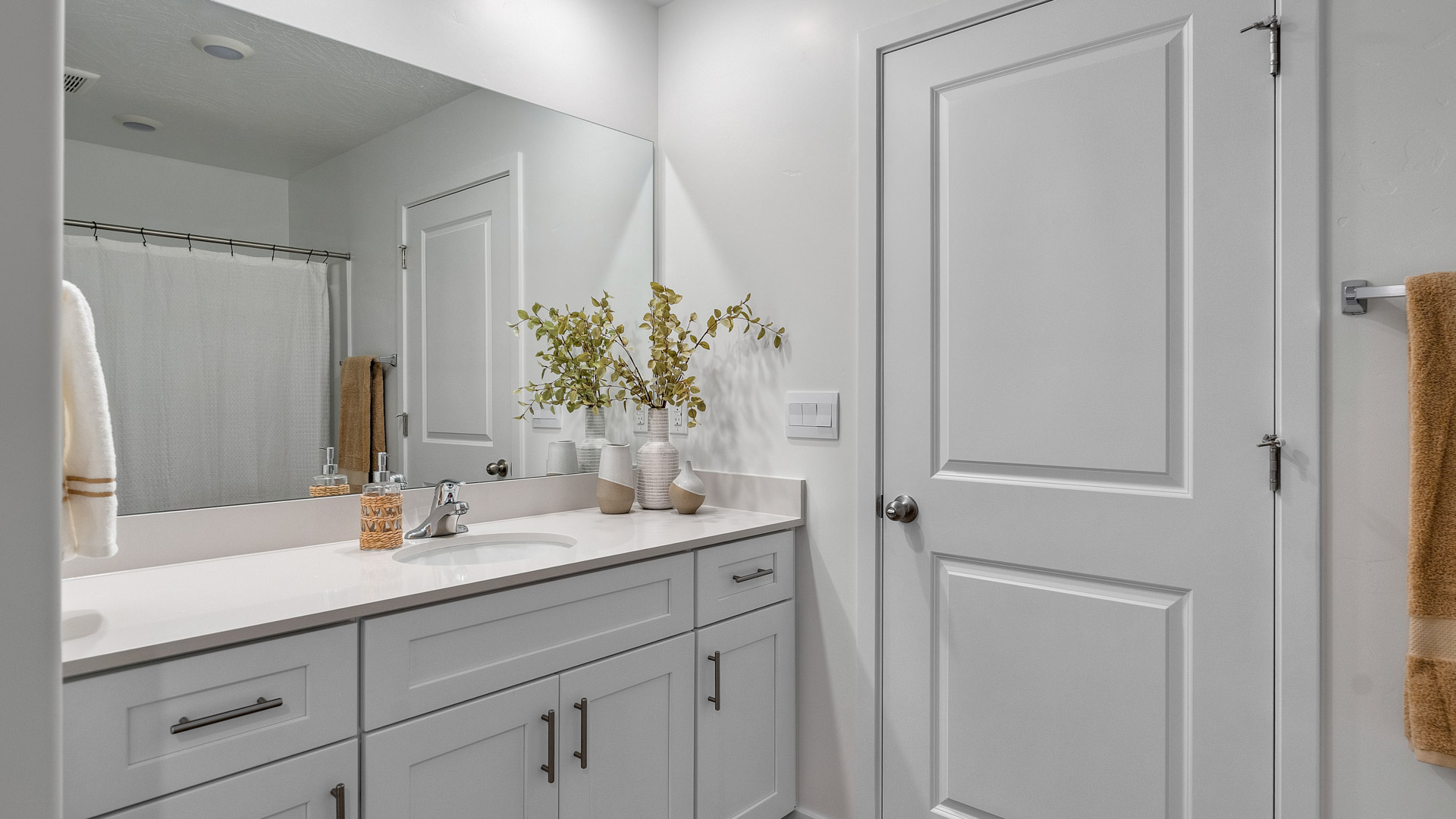 Large bathroom with built in shelving for storage