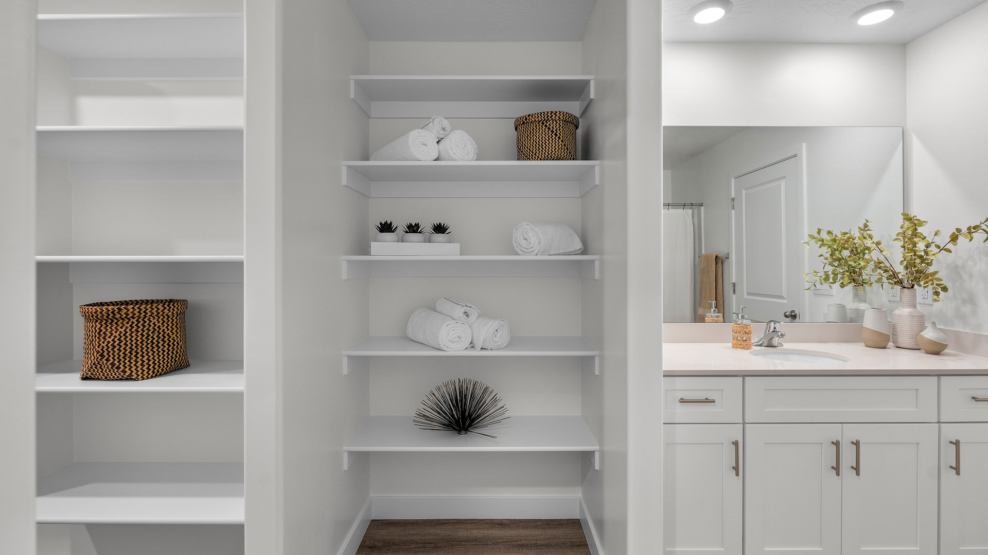 Large bathroom with built in shelving for storage