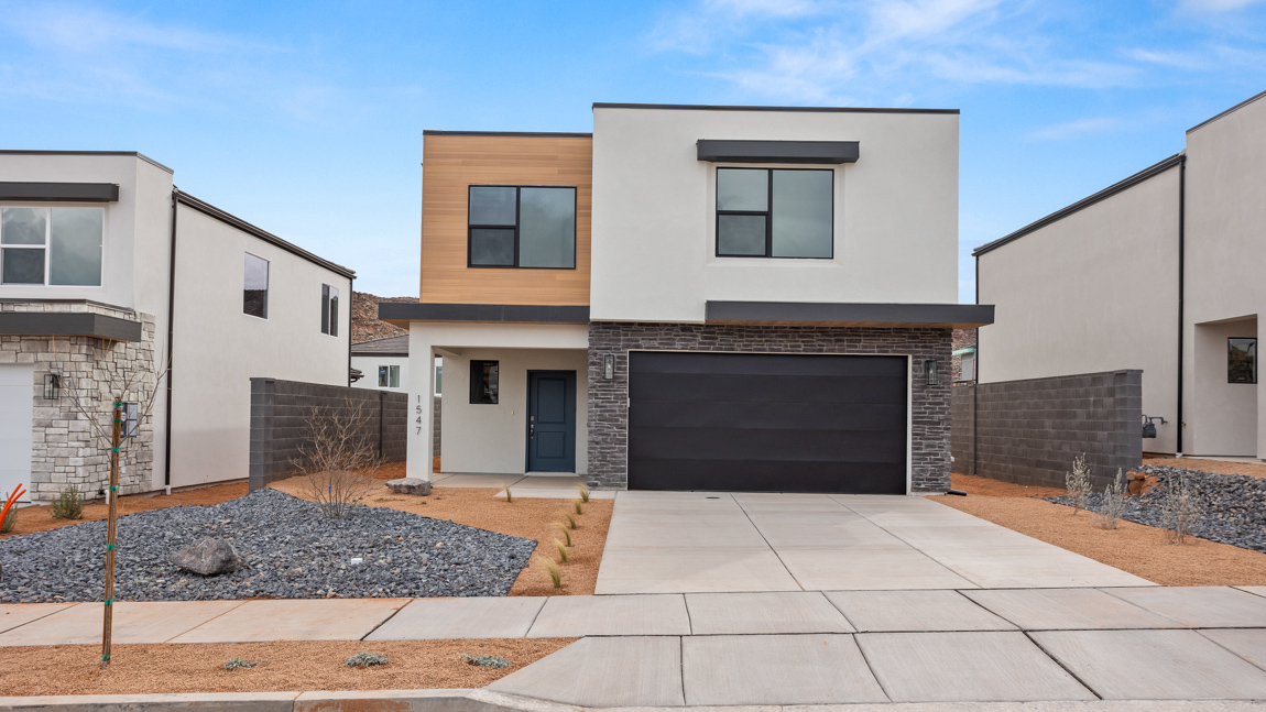 Brand new single family home in Washington with a Modern style exterior and two car garage.