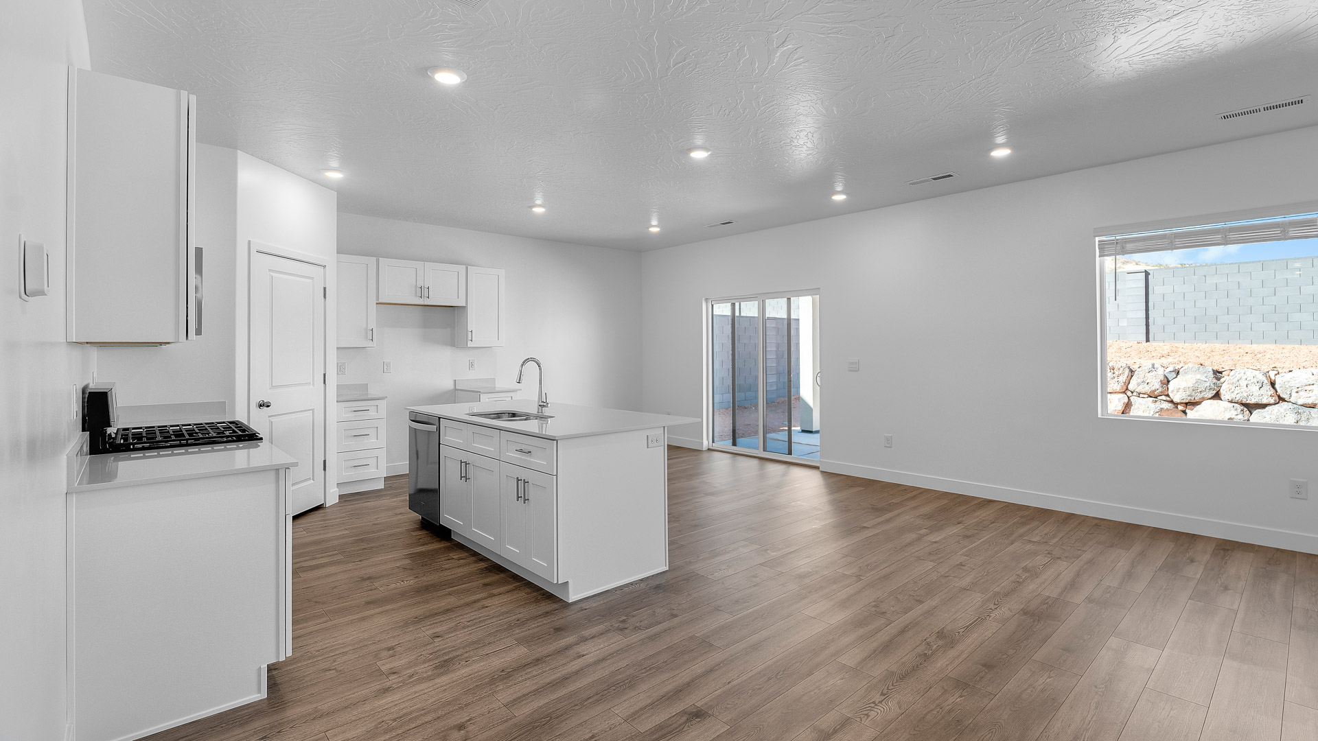 Main living space with large windows.