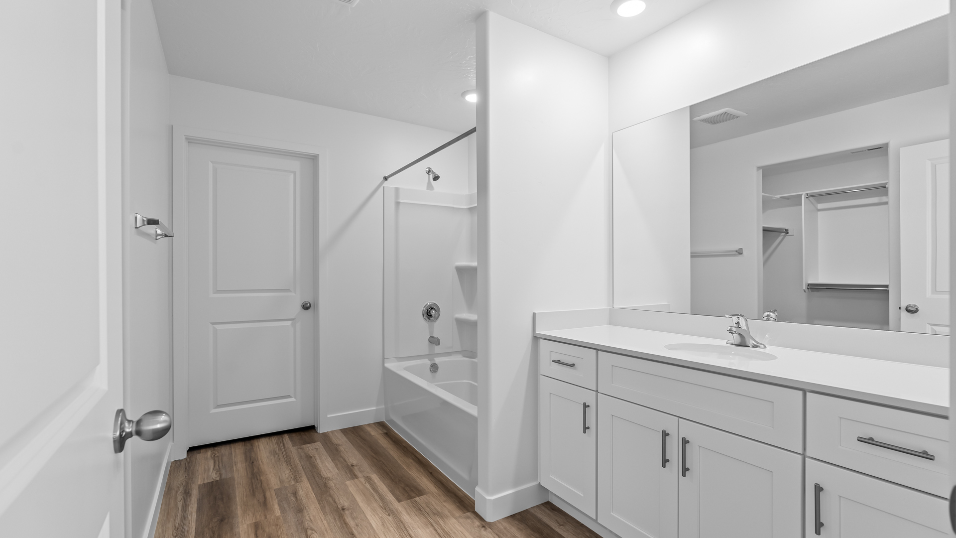 Primary bathroom with shower surround.