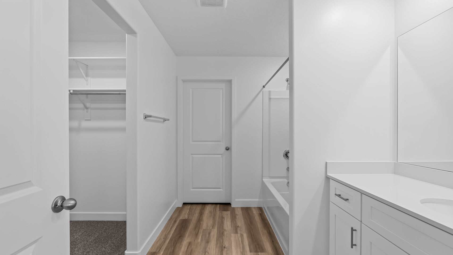 Primary bathroom with shower surround.