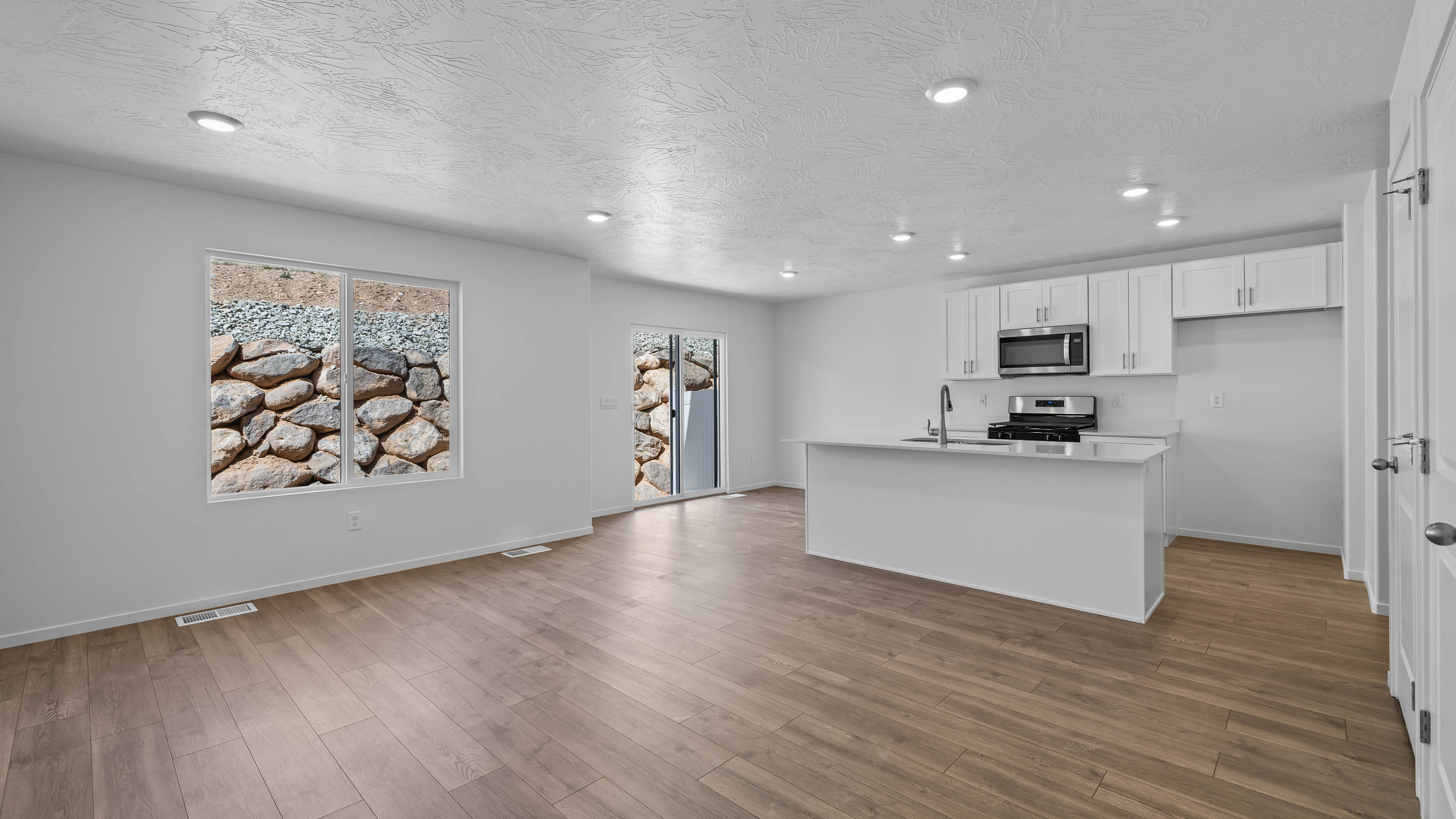 Large open family room with kitchen and dining room