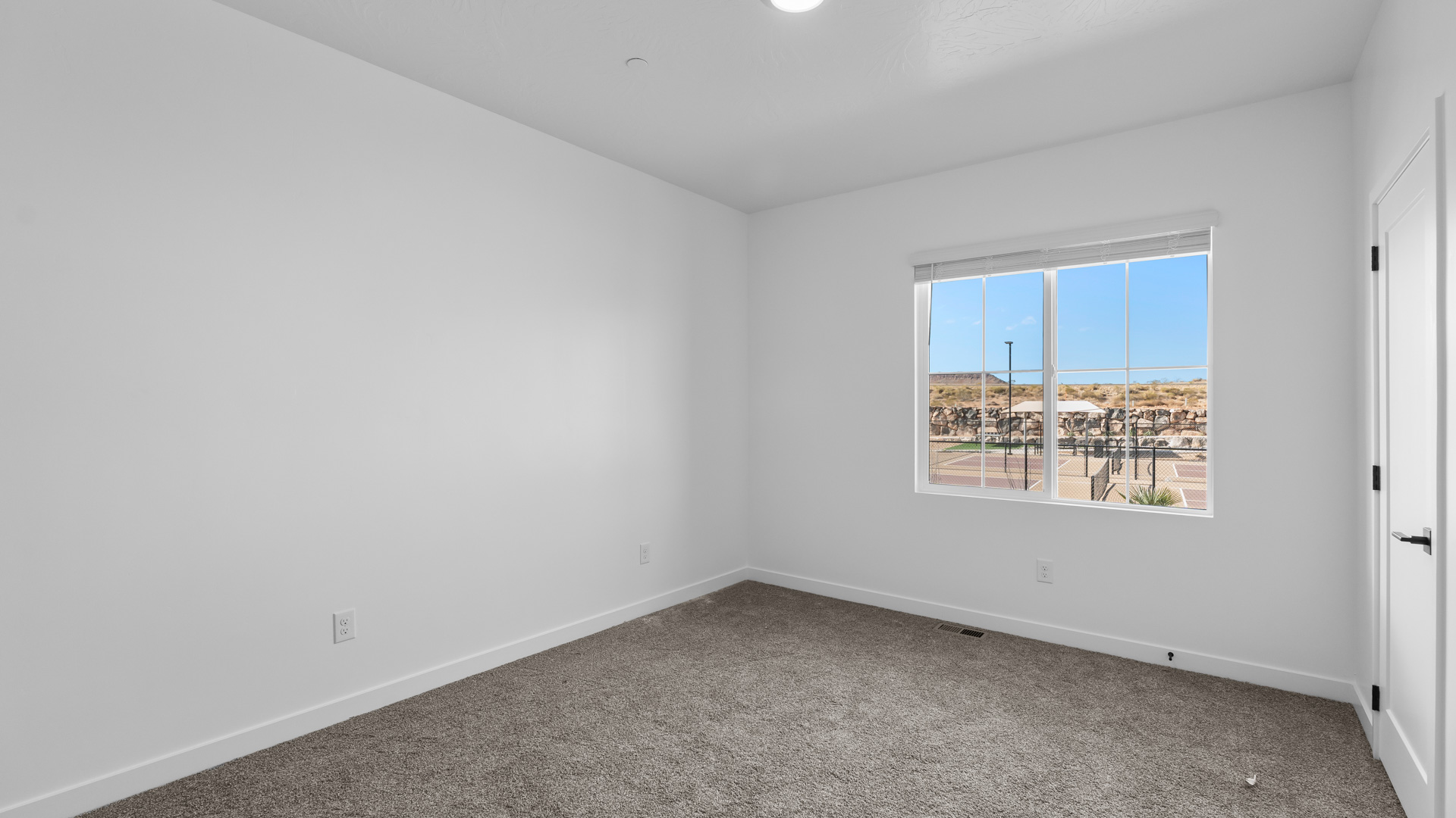 Bedroom with large window.
