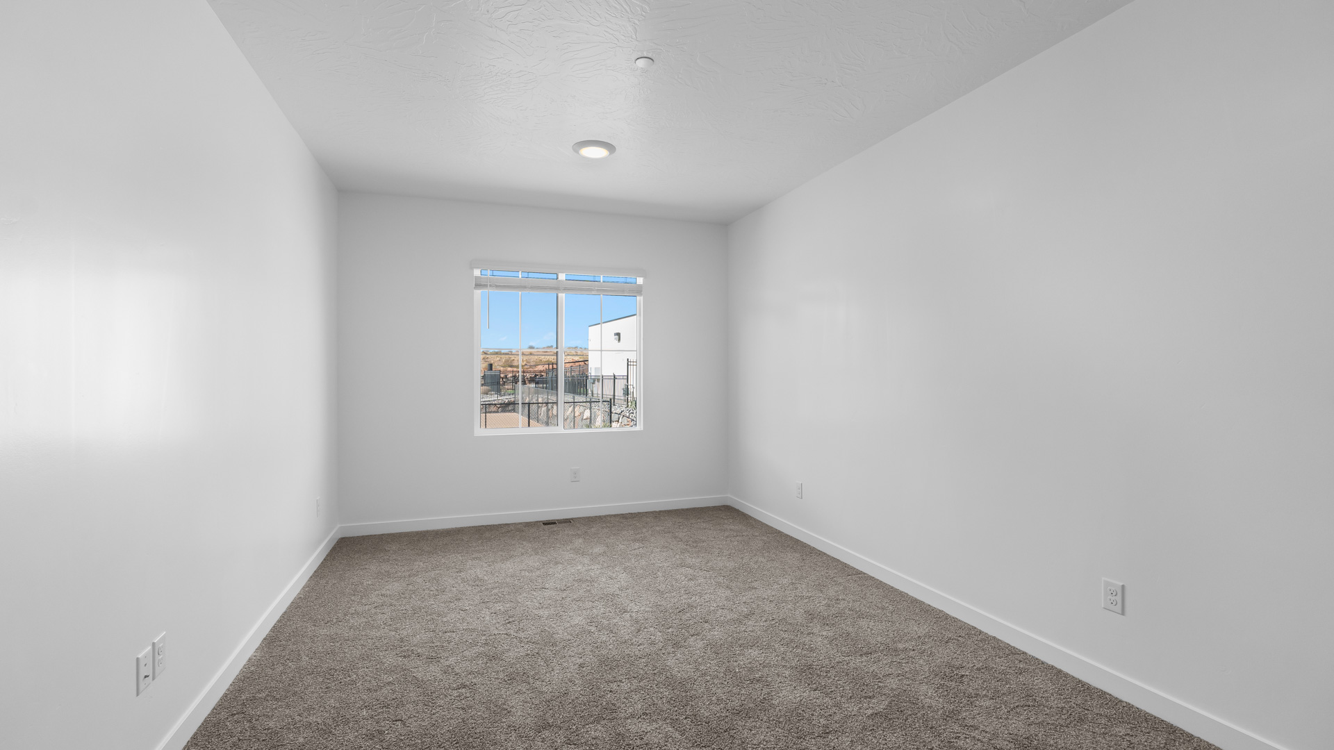 Bedroom with large window.