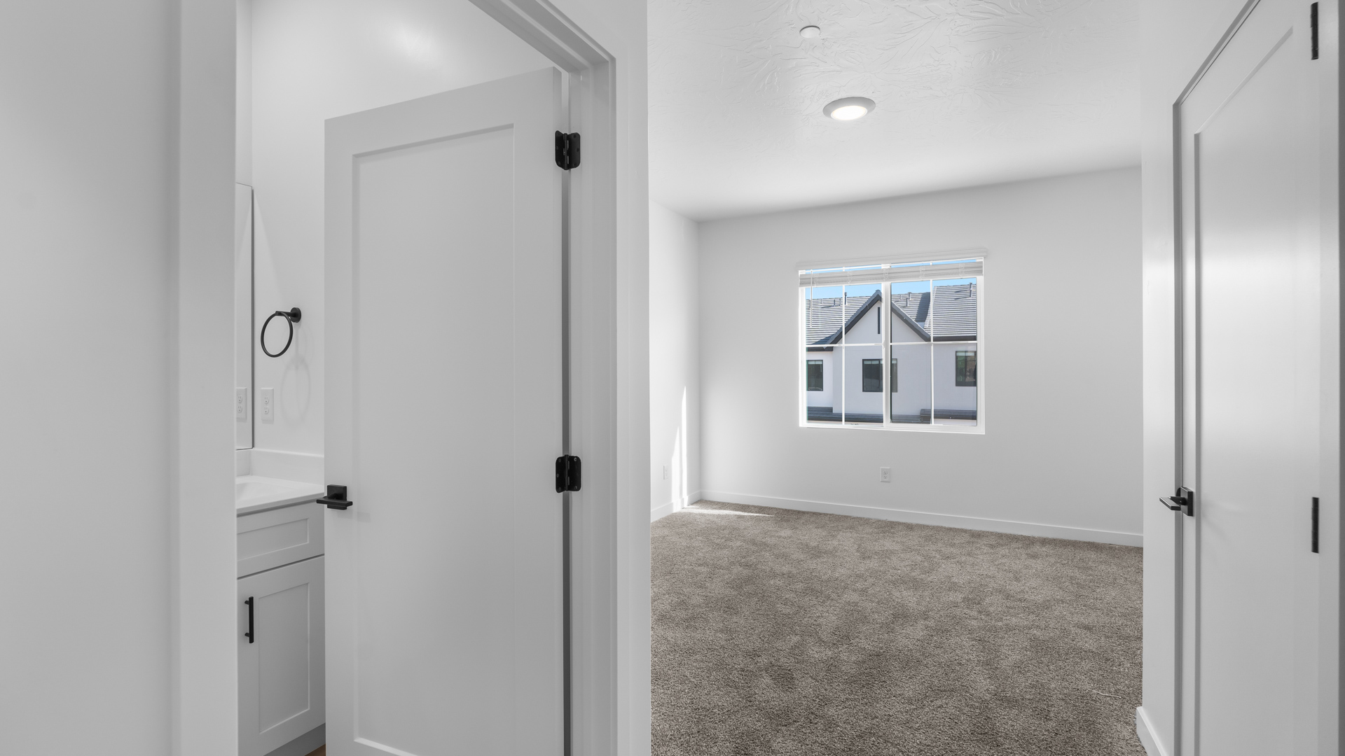 Bedroom with large window.