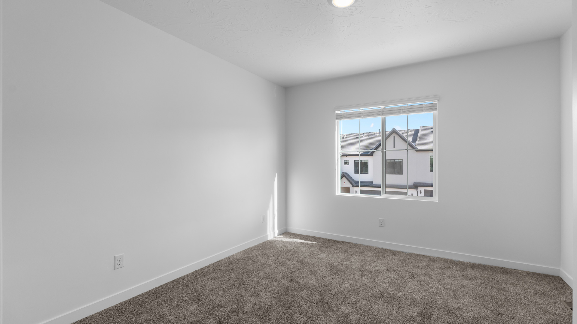 Bedroom with large window.