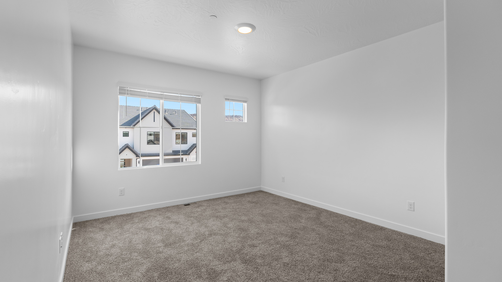 Bedroom with large window.