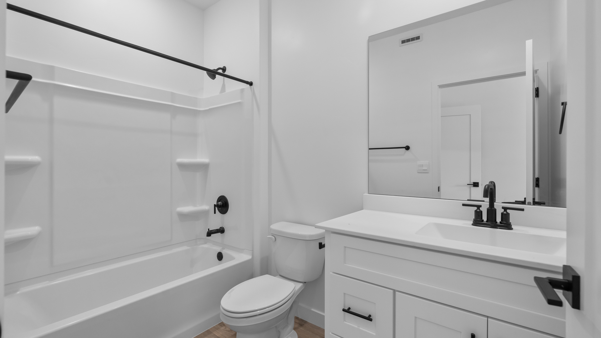 Bathroom featuring white cabinets and countertops.