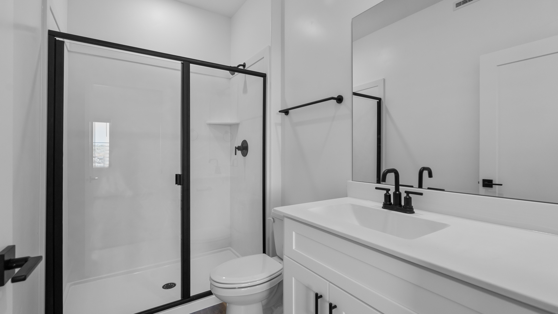 Bathroom featuring white cabinets and countertops.