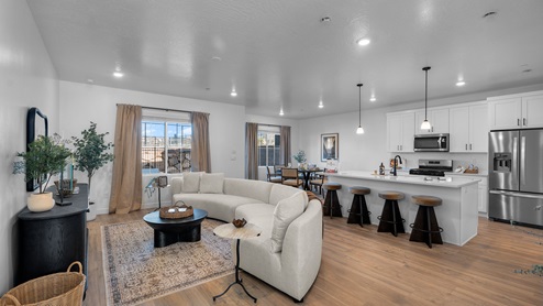 Main living space featuring living room, kitchen, and dining.