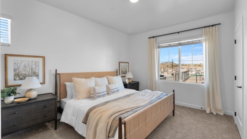 Bedroom with large window.
