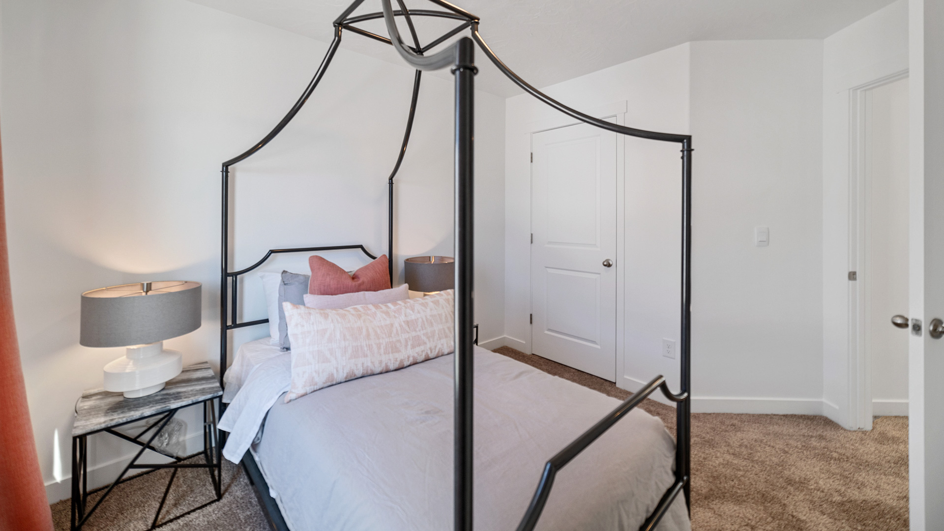 Bedroom with large window and closet.