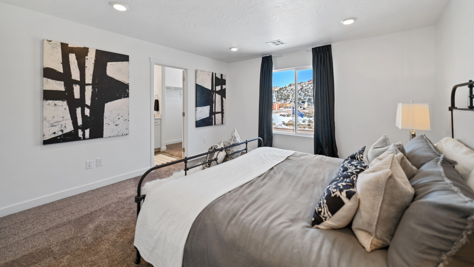 Other view of primary bedroom into primary bath and hallway.