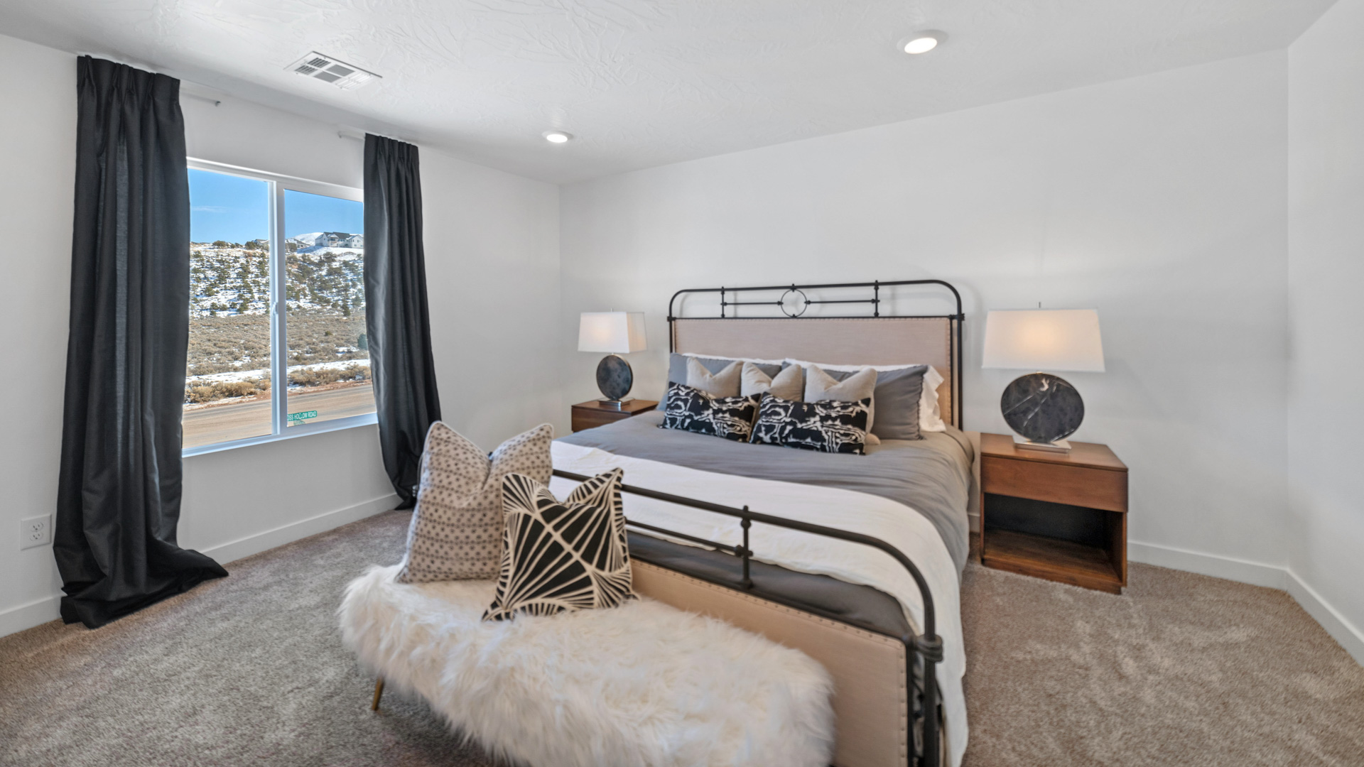 Bedroom with large window and closet.
