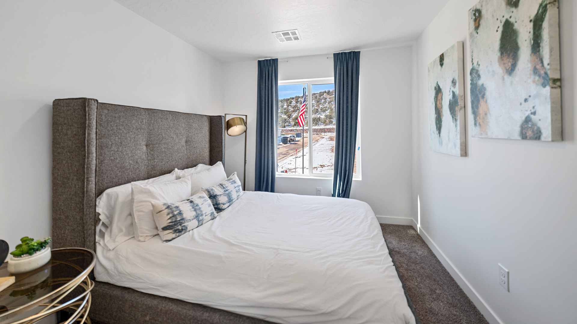 Bedroom with large window and closet.