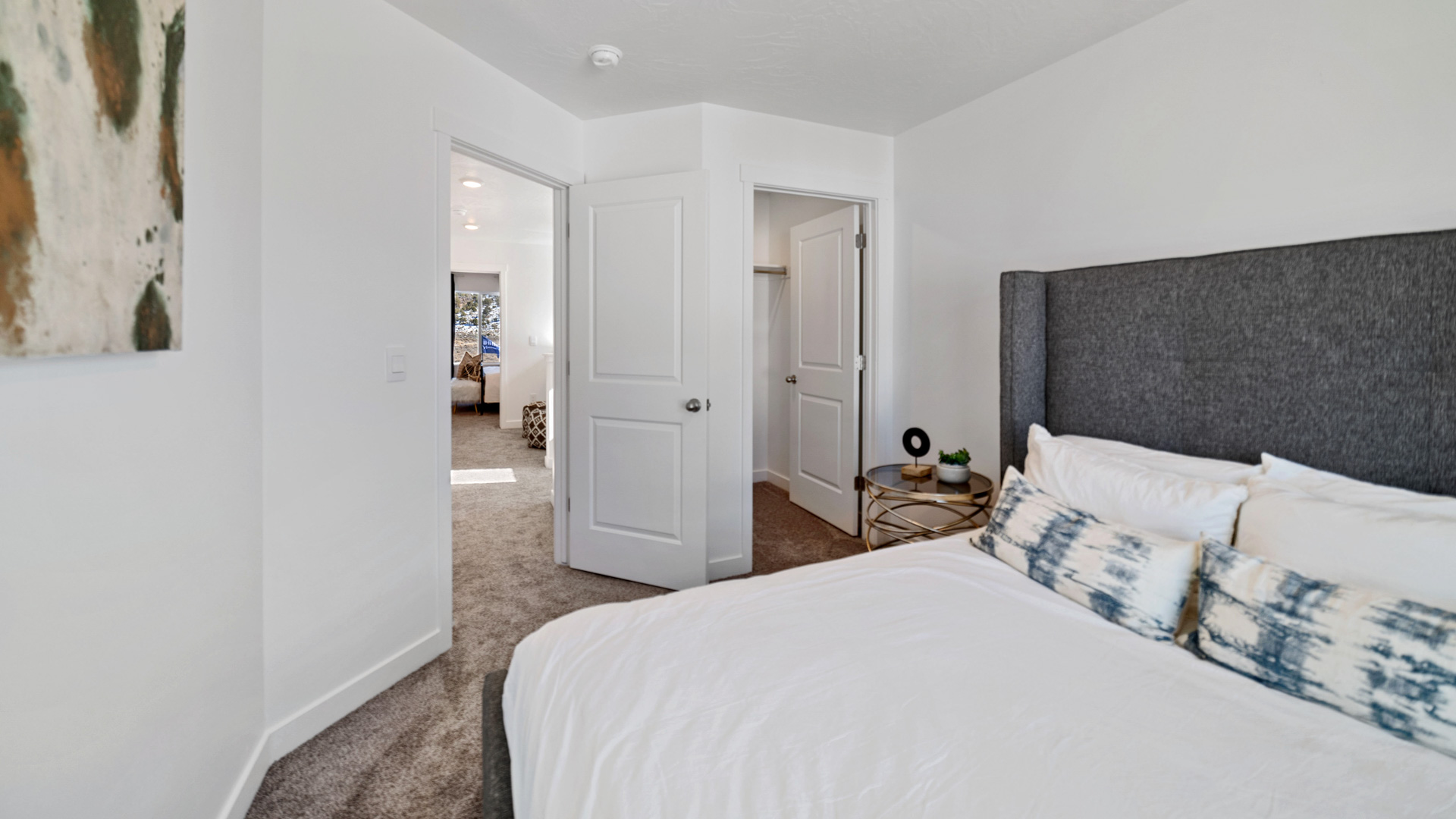 Bedroom with large window and closet.