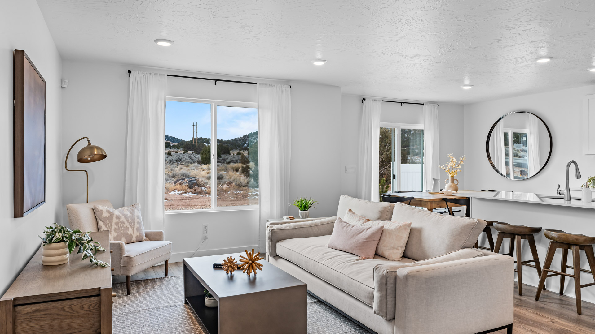 View of spacious living room with large window.