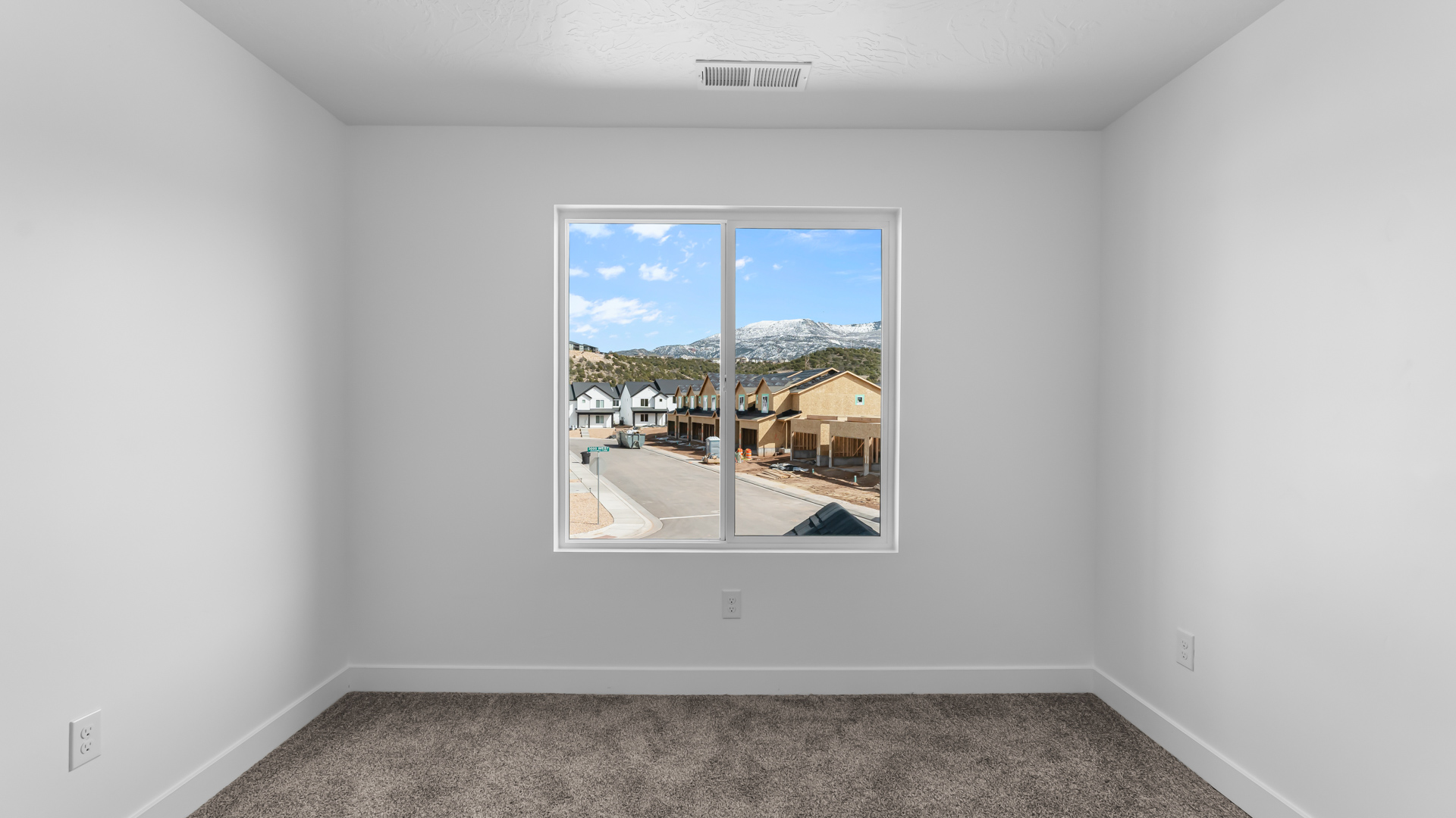 Bedroom with large window.