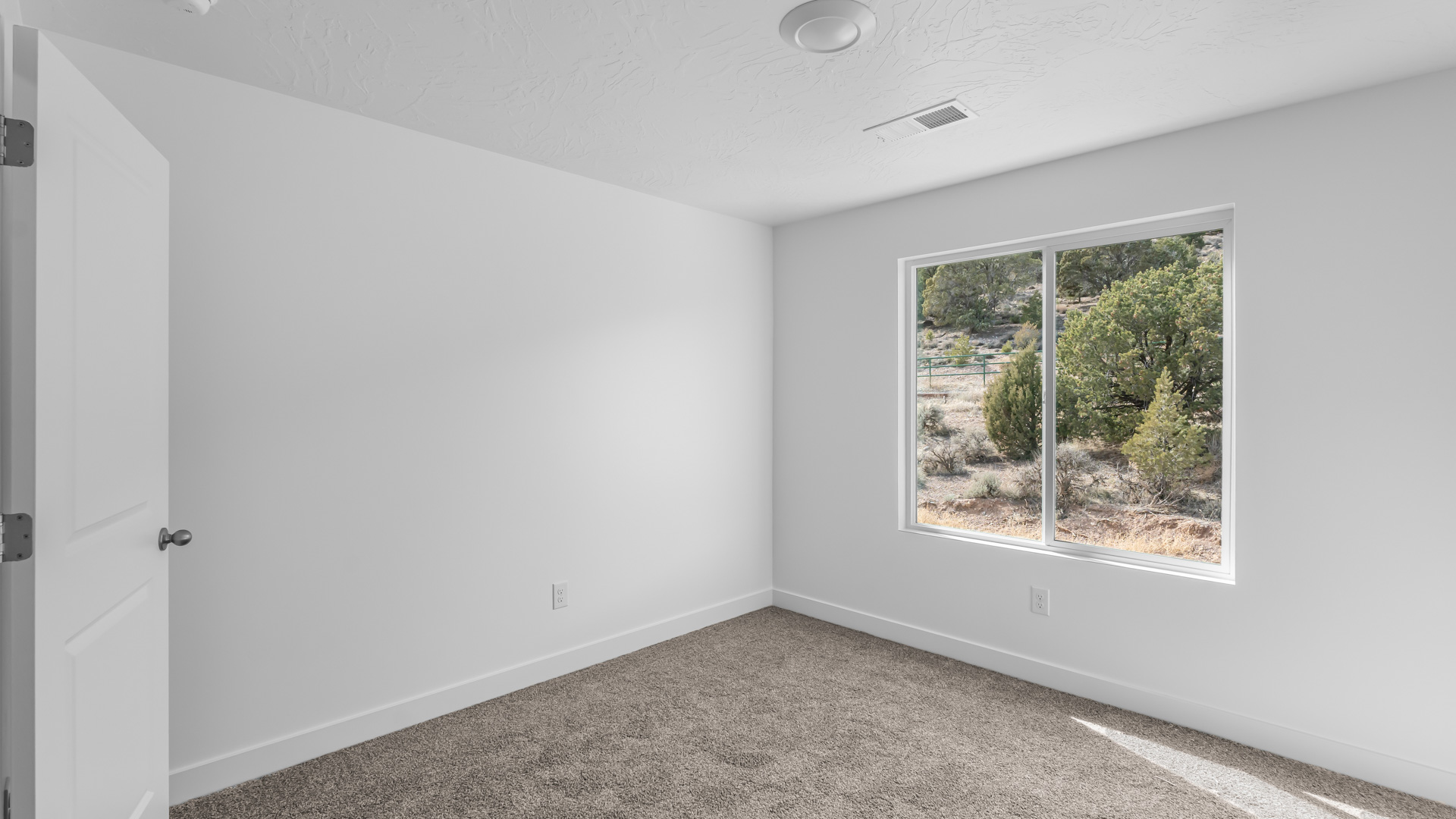 Bedroom with large window.