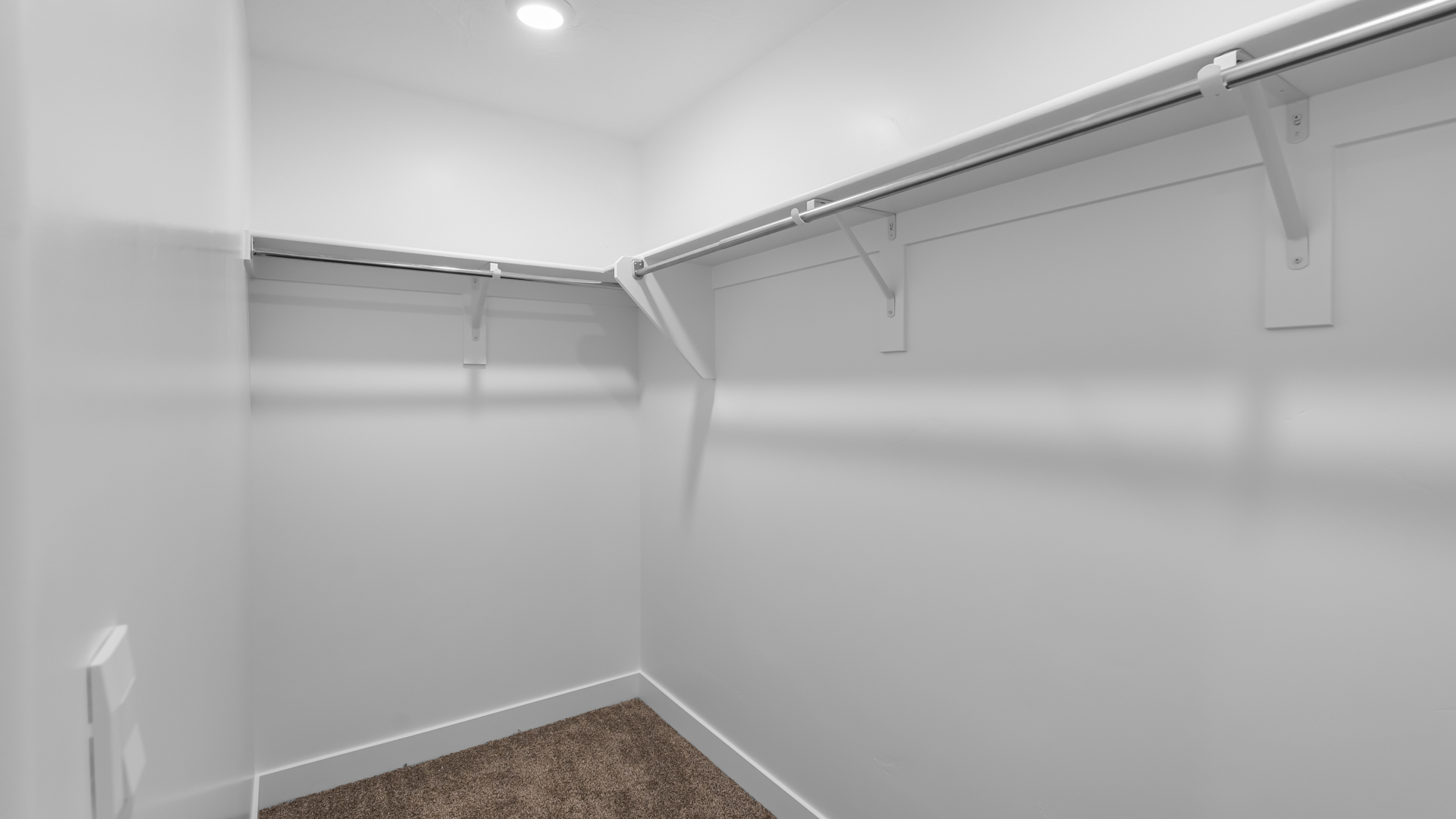 Primary spacious walk-in closet.