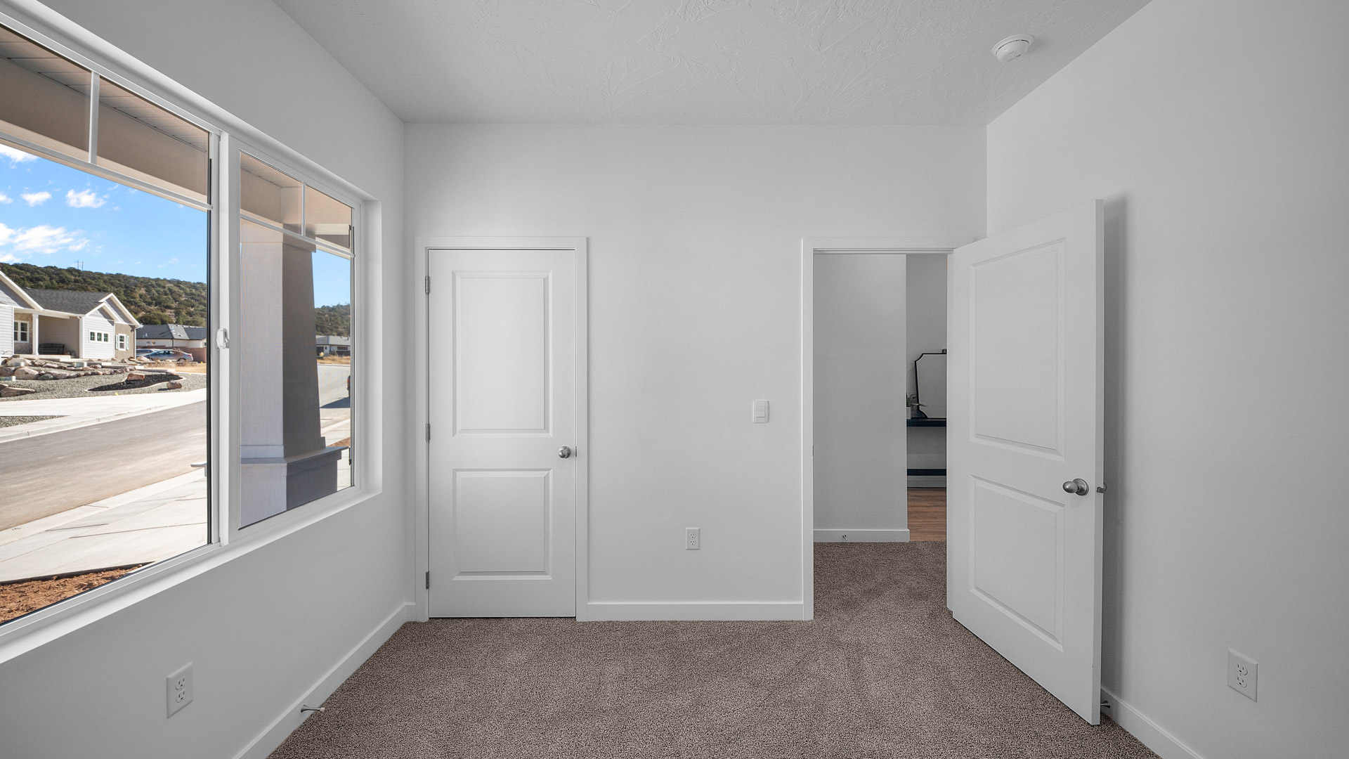 Front bedroom with large window.