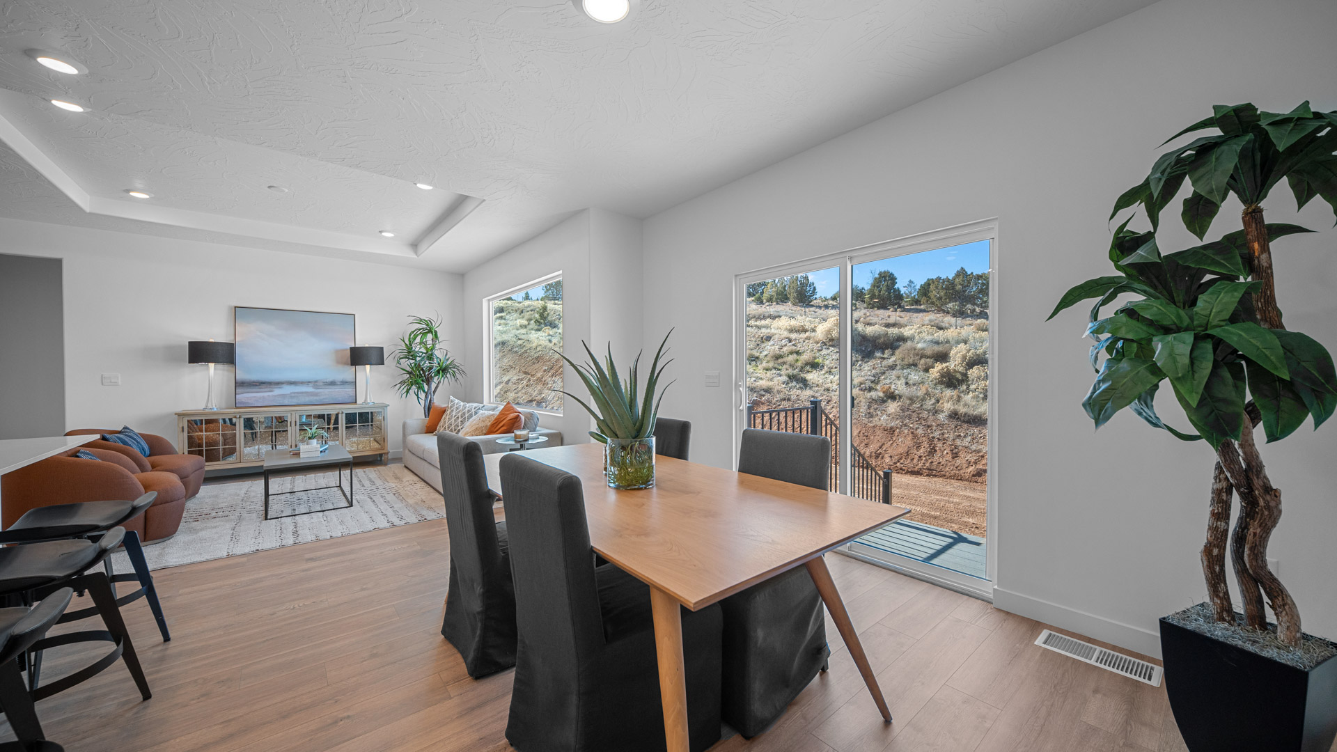 Dining space with large glass patio doors.