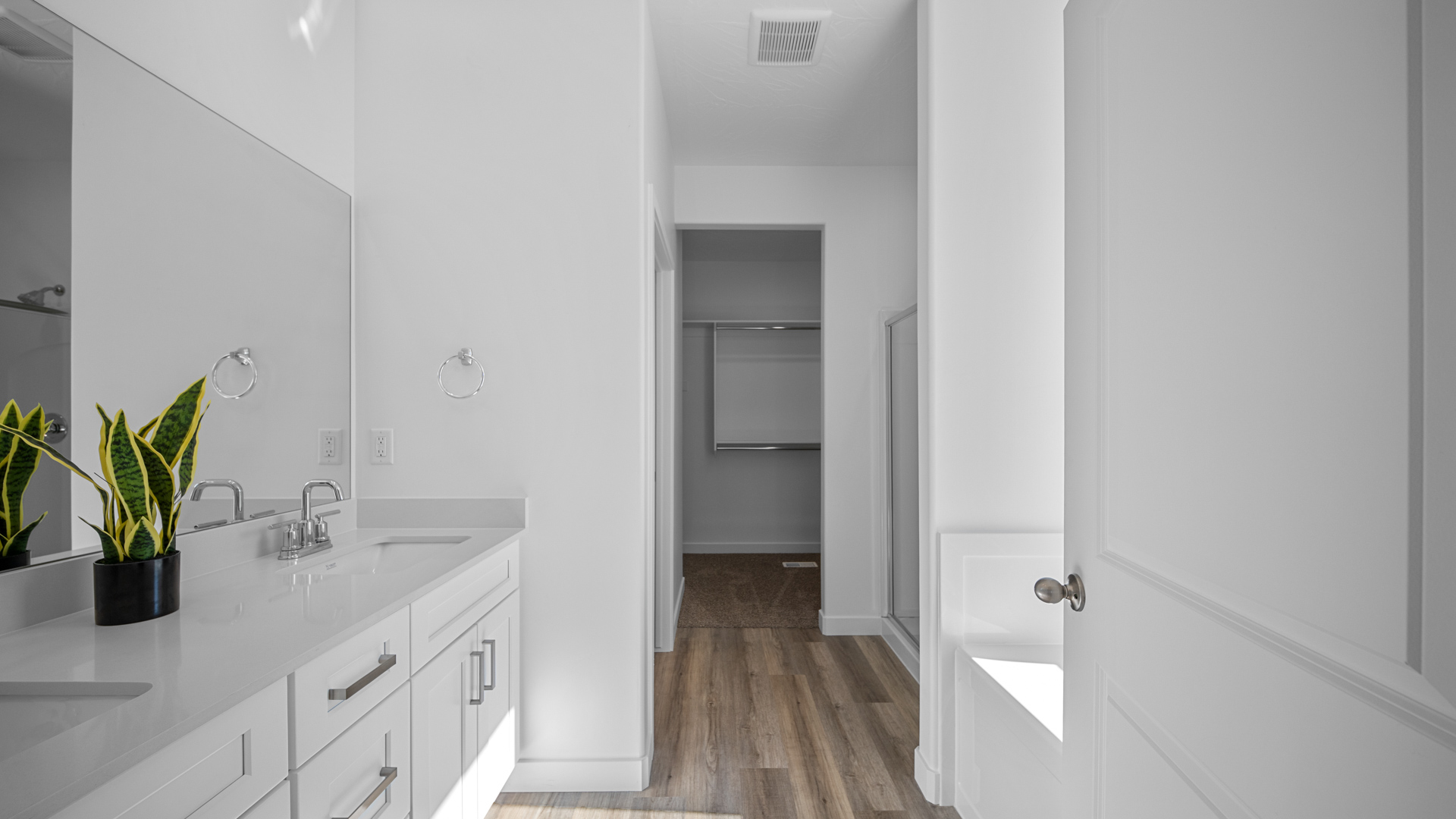Primary bathroom with double sink vanity.