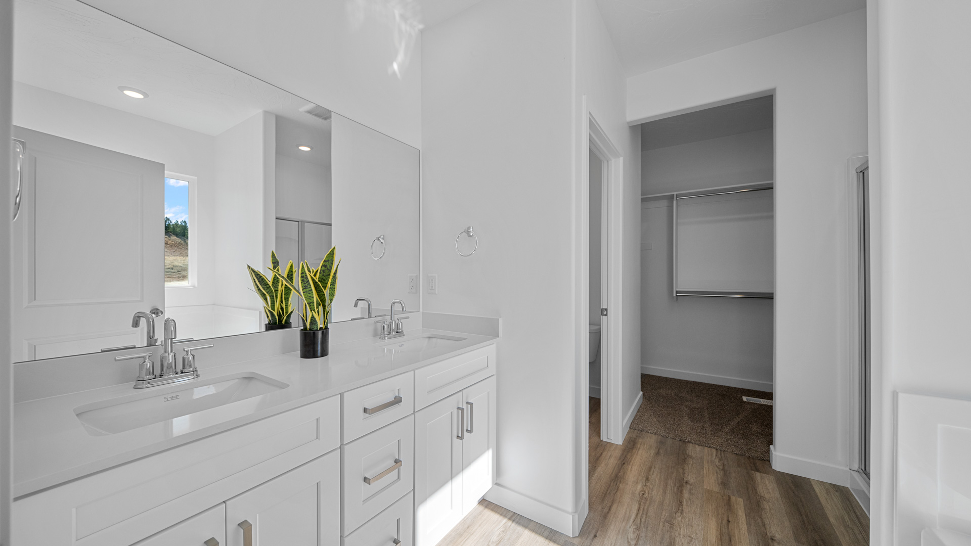 Primary bathroom with double sink vanity.
