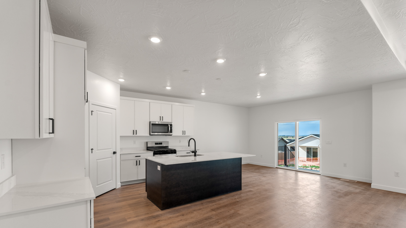 Kitchen featuring dining space and patio doors.