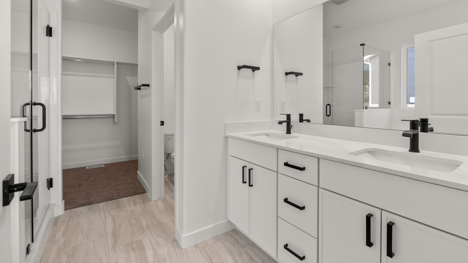 Primary bathroom with double sink vanity.