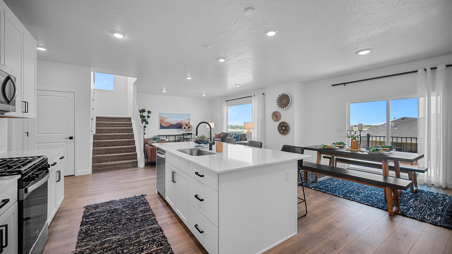Kitchen with kitchen island featuring sink and stainless steel appliances.
