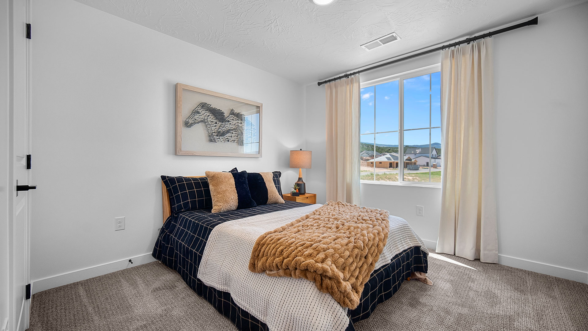Bedroom with large window.