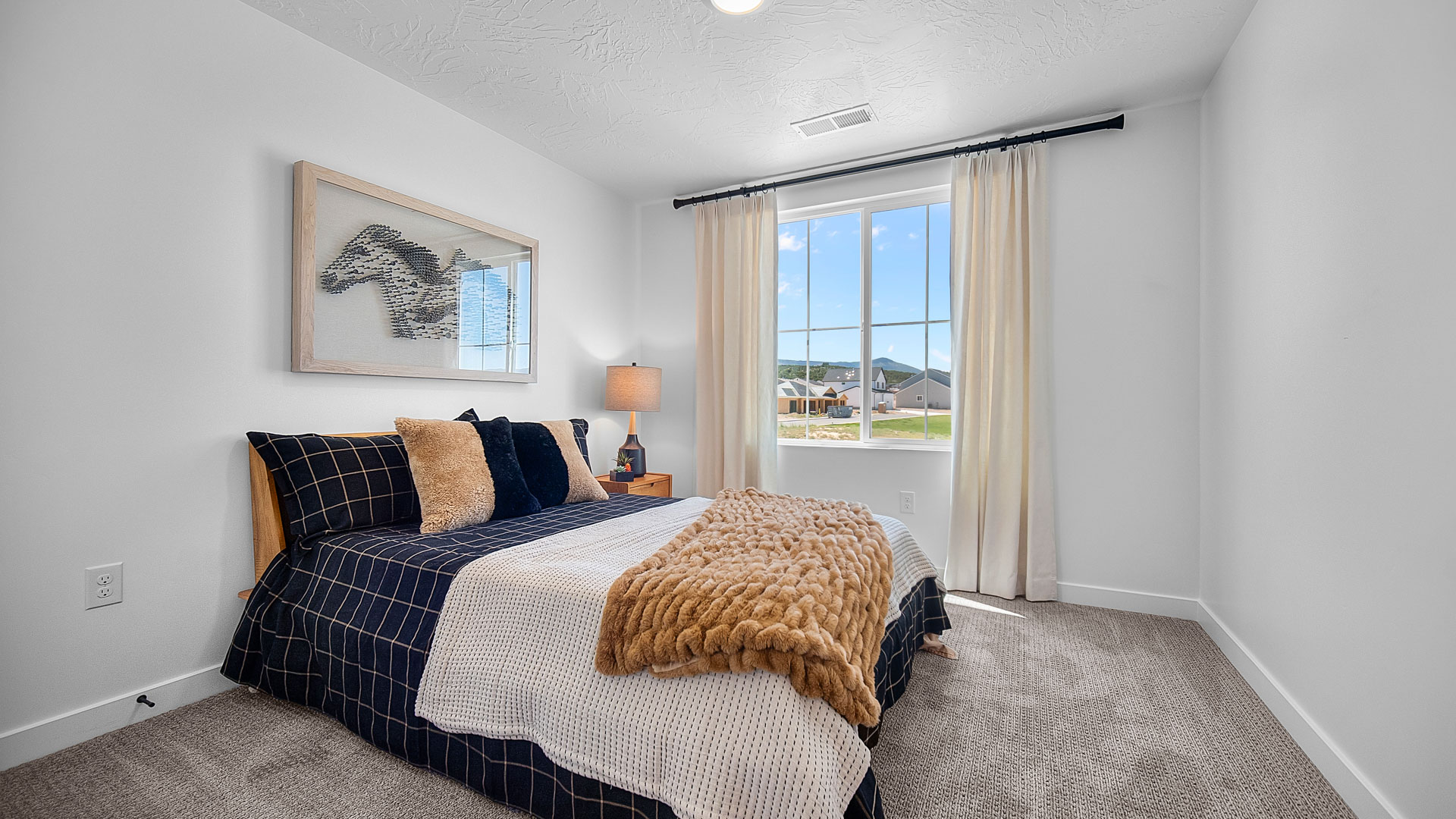 Bedroom with large window.