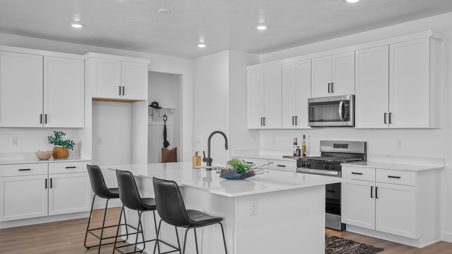 Kitchen with kitchen island featuring sink and stainless steel appliances.