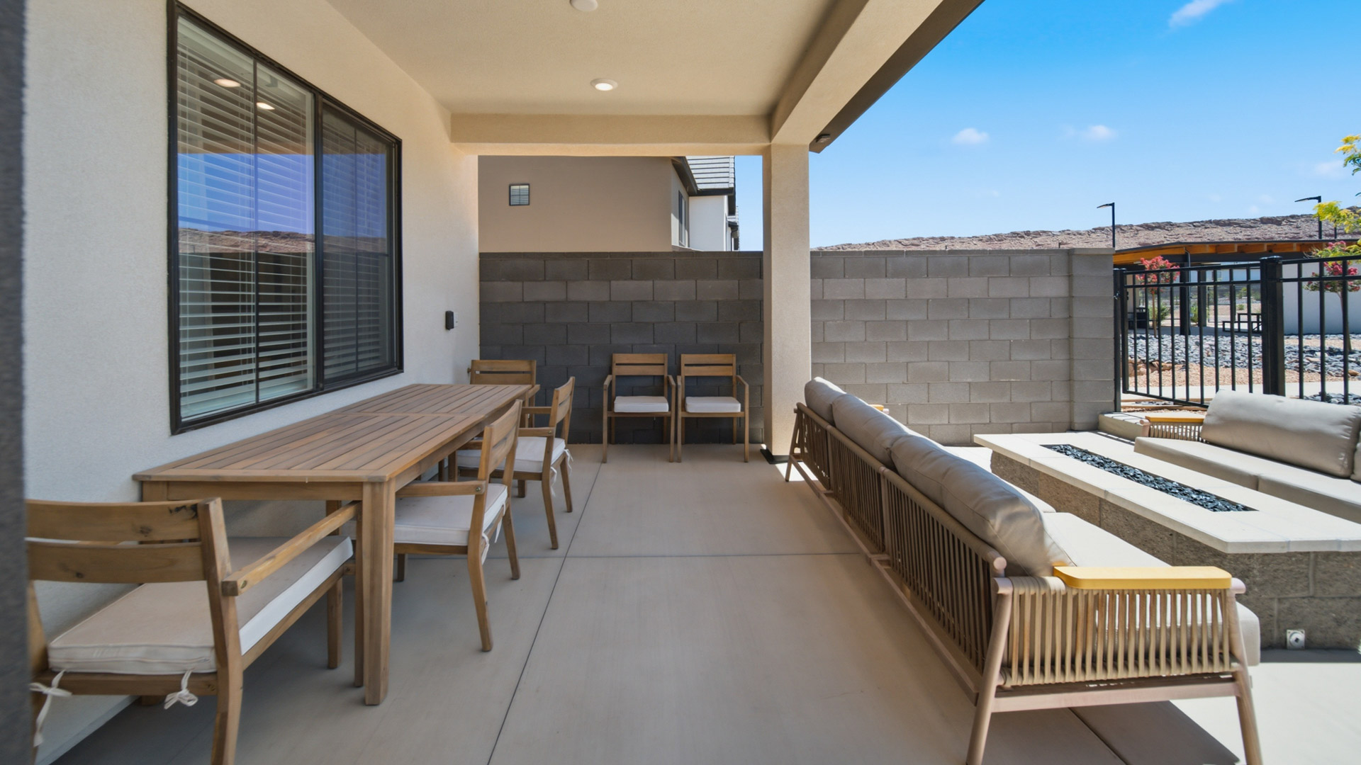 Back of home with patio.