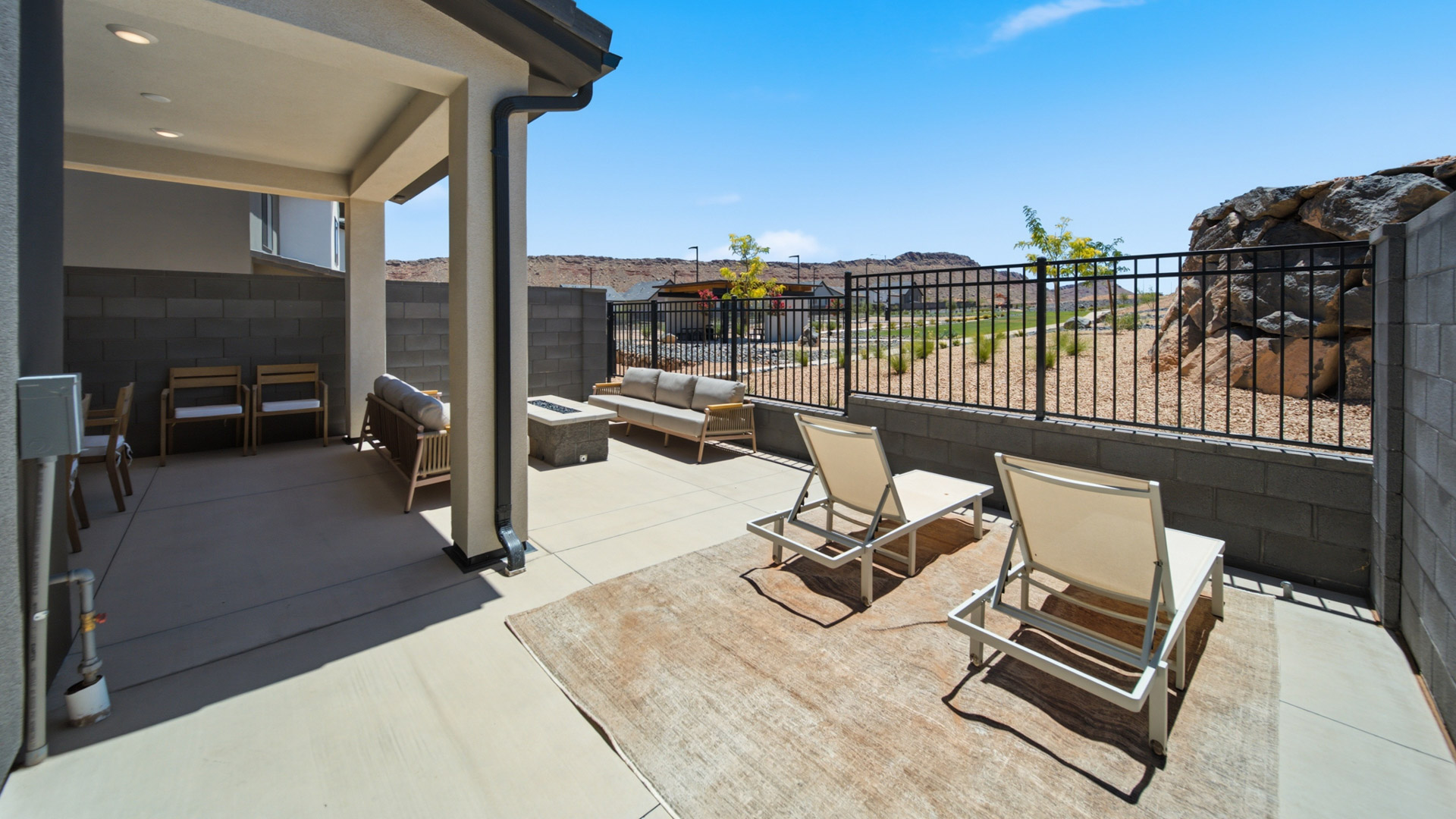 Back of home with patio.