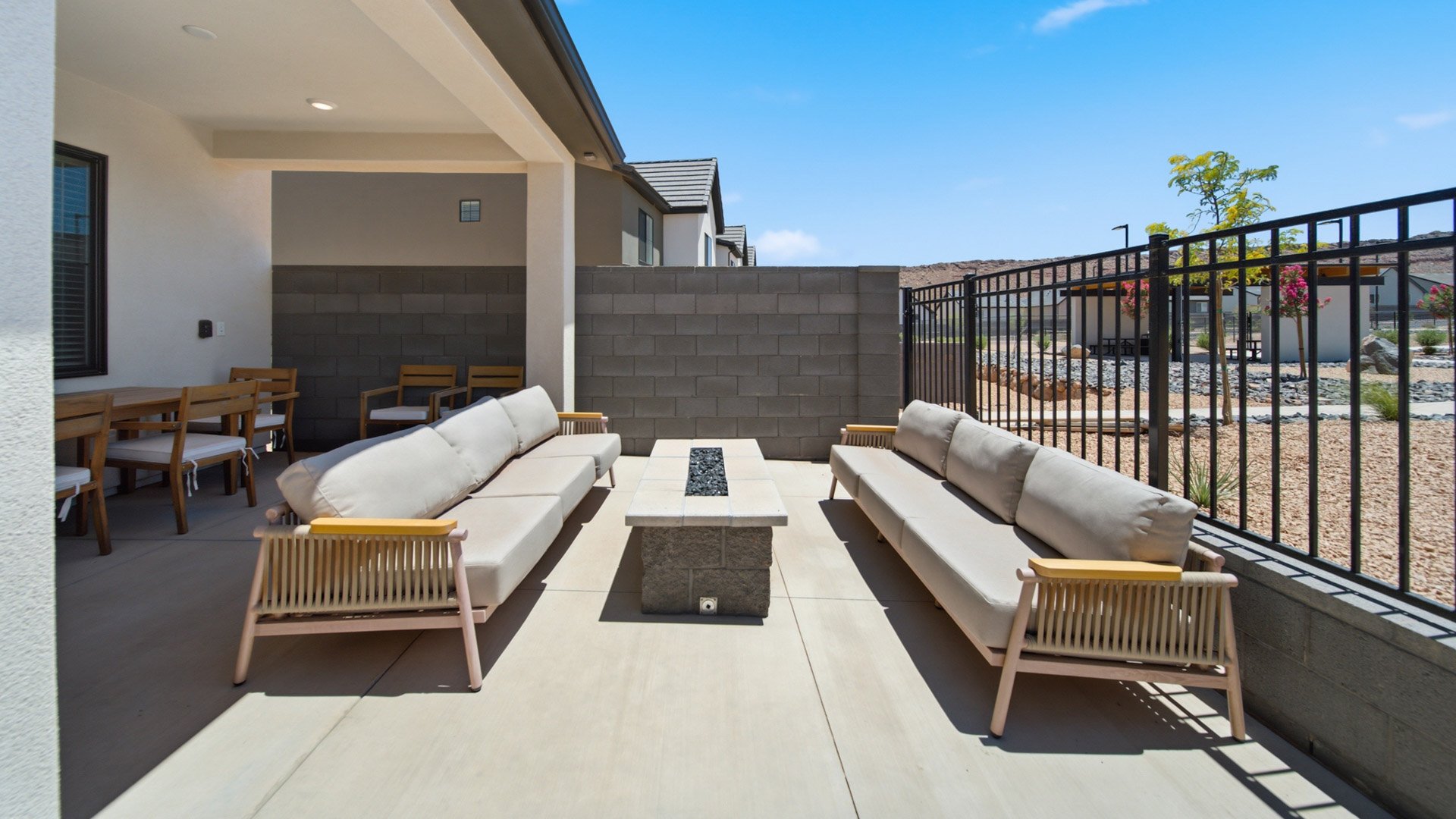 Back of home with patio.