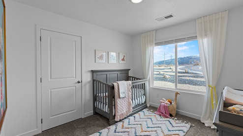 Bedroom with large window.
