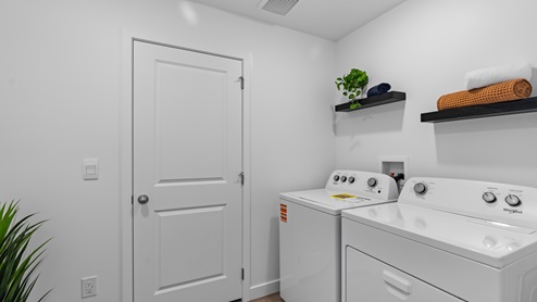 Laundry room space off of garage.