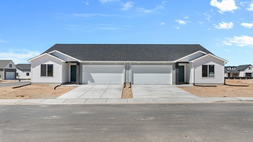 Elevation cape code Bella townhome plan in Pointe West.