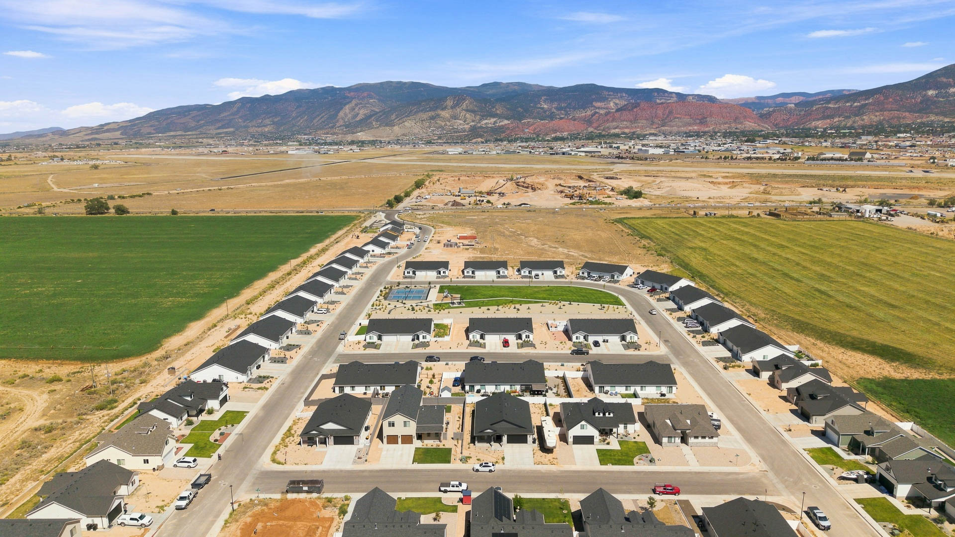 Aerial views of Pointe West amenities with park, pavilion, playground, and pickleball court.
