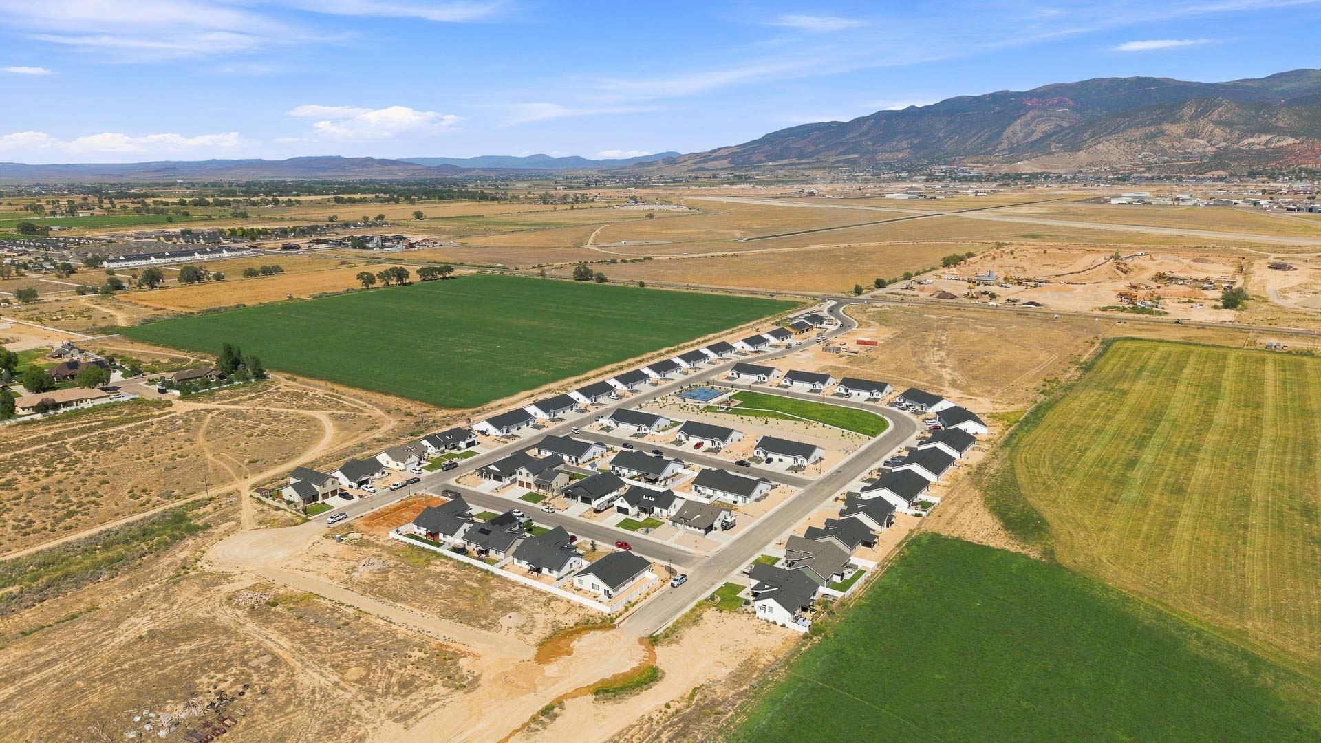 Aerial views of Pointe West amenities with park, pavilion, playground, and pickleball court.