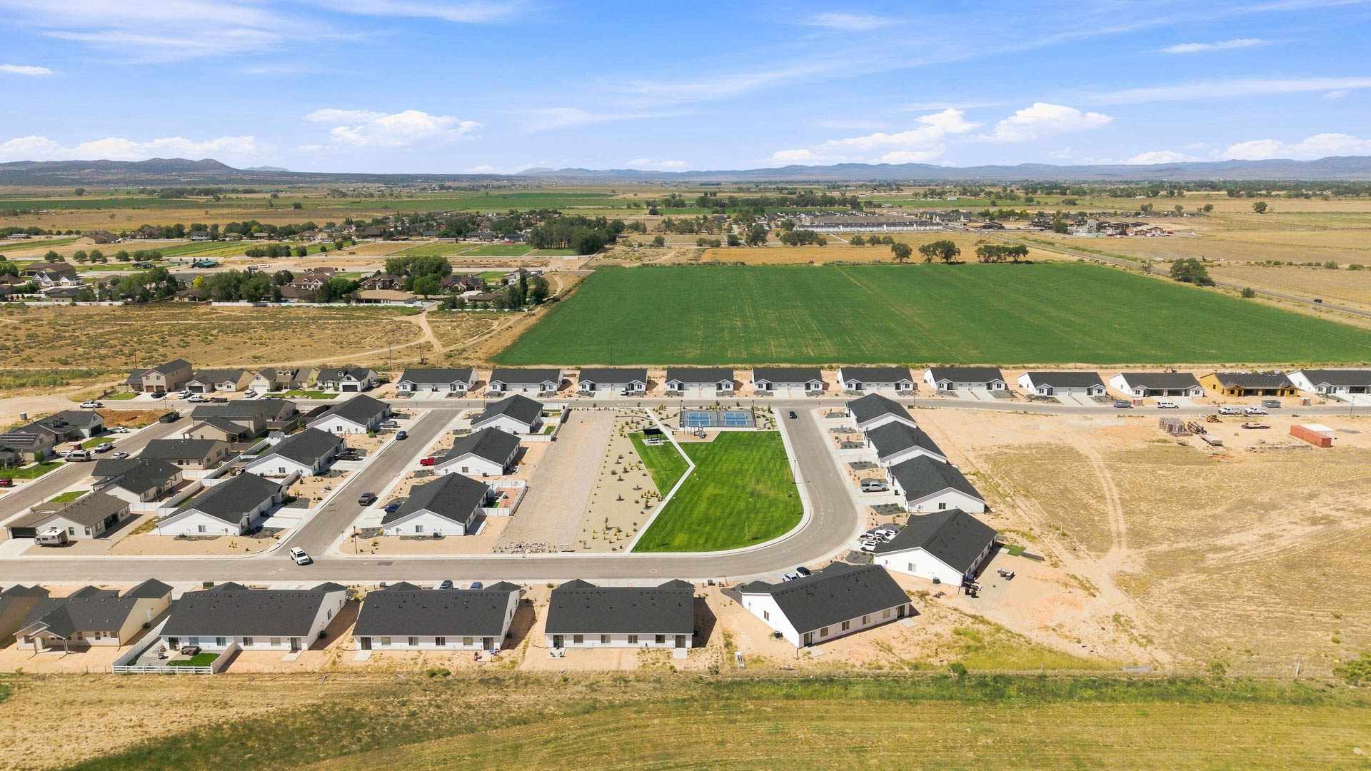 Aerial views of Pointe West amenities with park, pavilion, playground, and pickleball court.