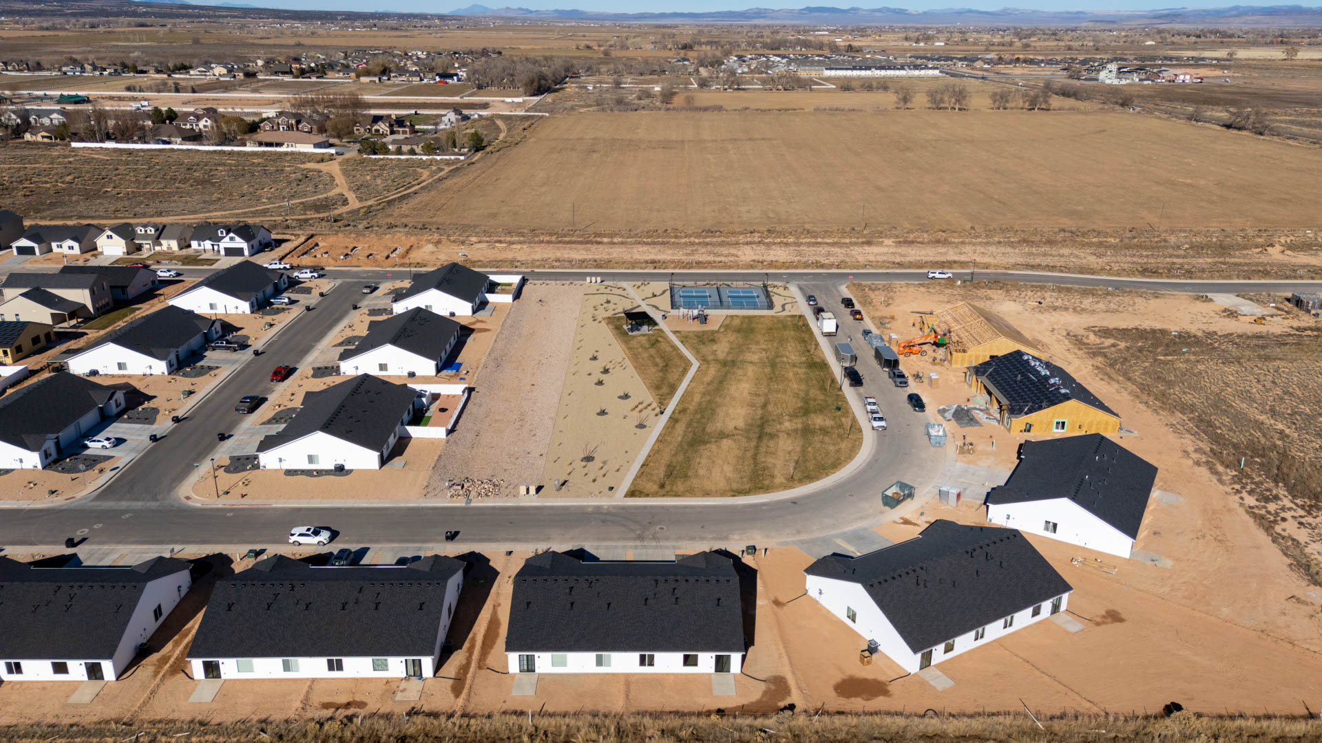 Aerial views of Pointe West amenities with park, pavilion, playground, and pickleball court.