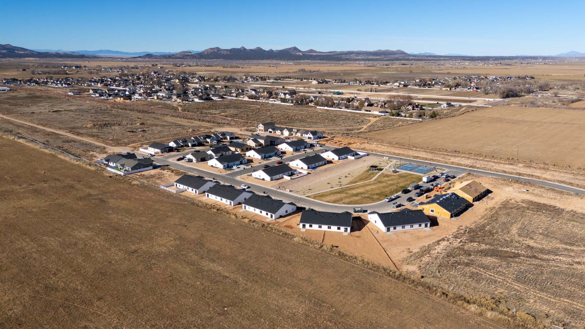 Aerial views of Pointe West amenities with park, pavilion, playground, and pickleball court.