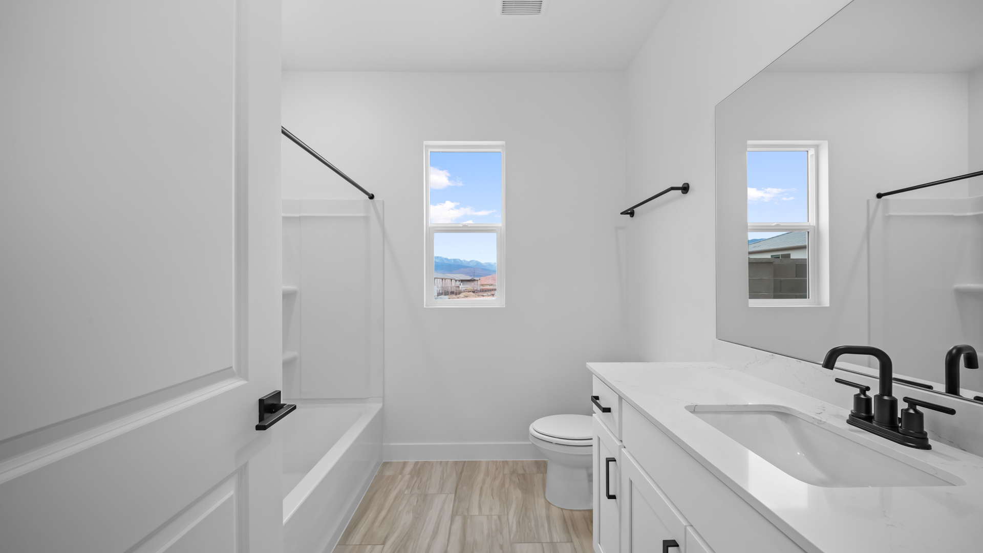 Bathroom with vanity and window.